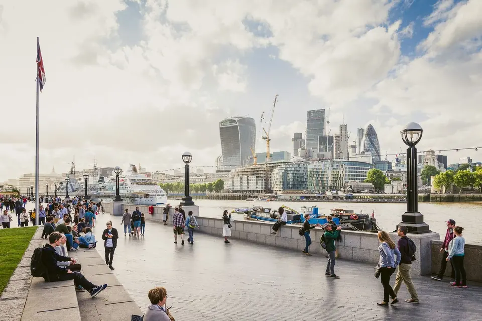 Thames riverside walk with the City of London skyline